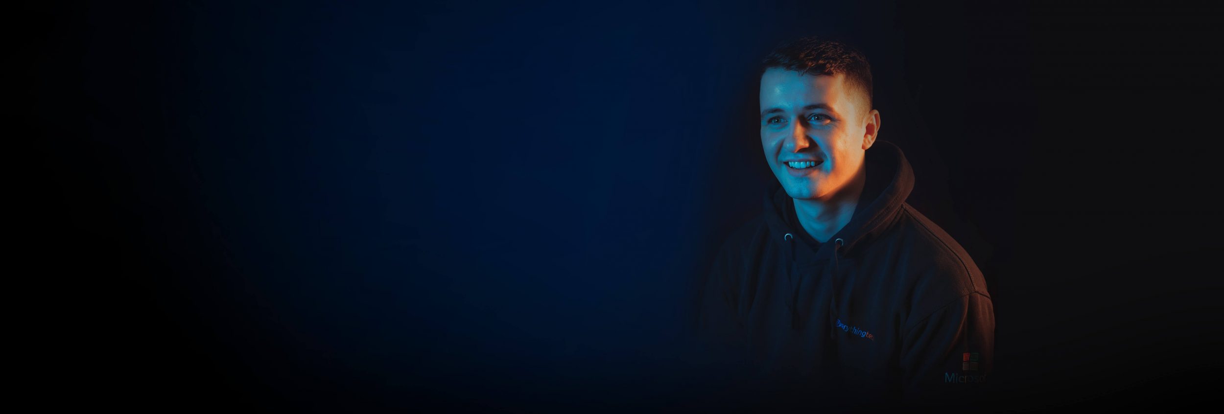 everything tech staff member right side blue gradient background for header