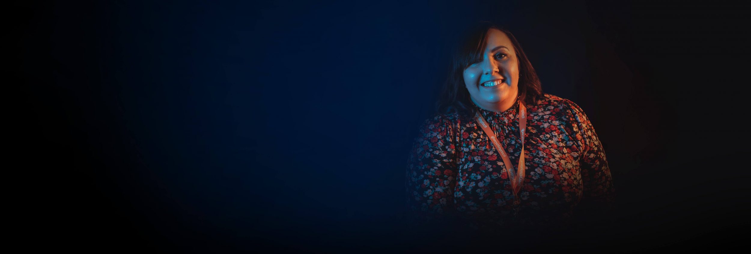 everything tech staff member right side blue gradient background for header