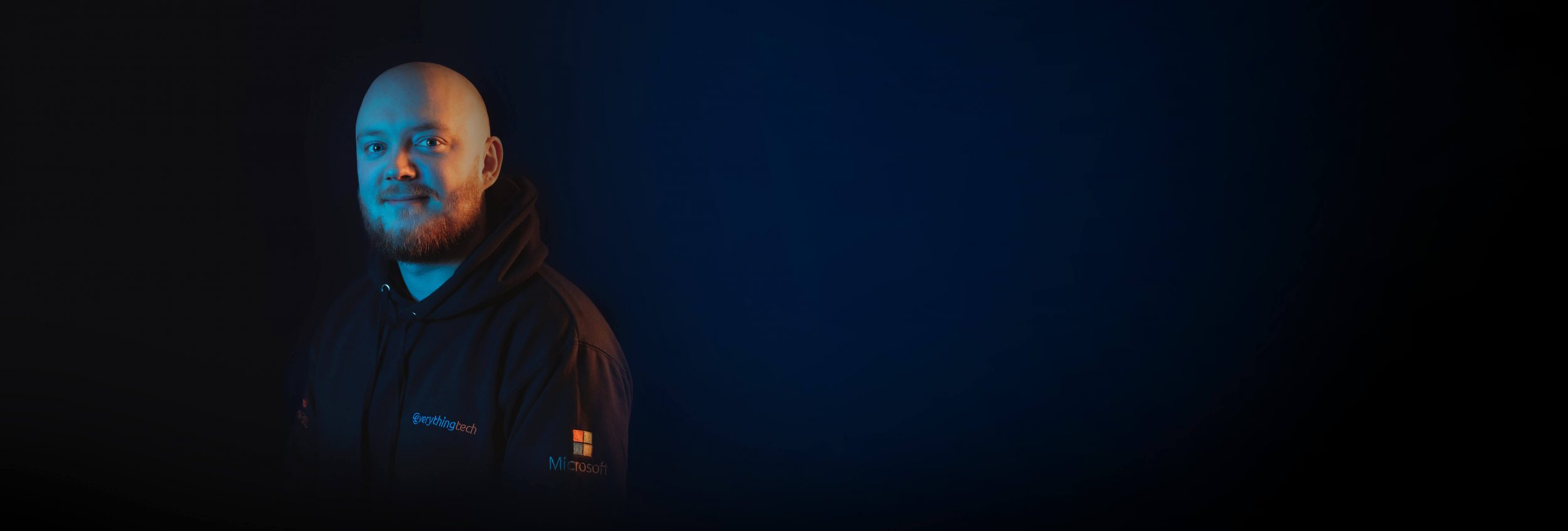 everything tech staff member left side blue gradient background for header