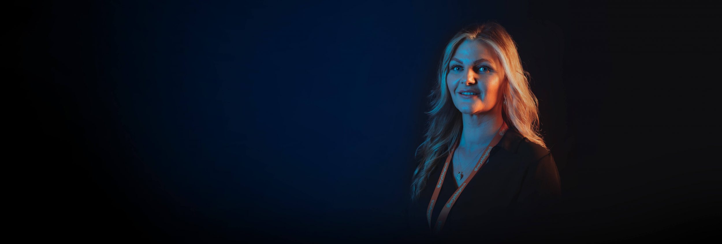 everything tech staff member right side blue gradient background for header