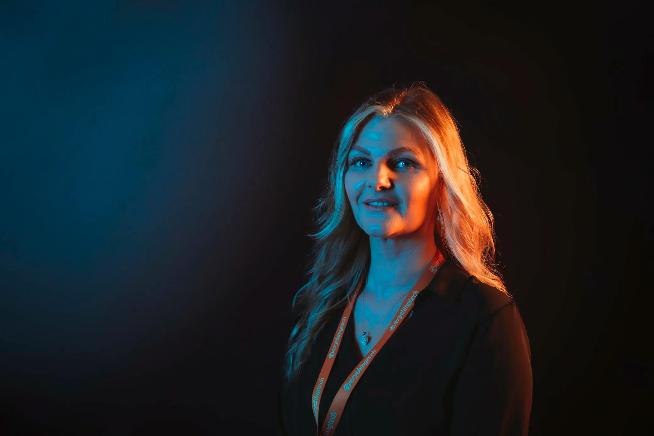 everything tech staff member international women's day with blue gradient background