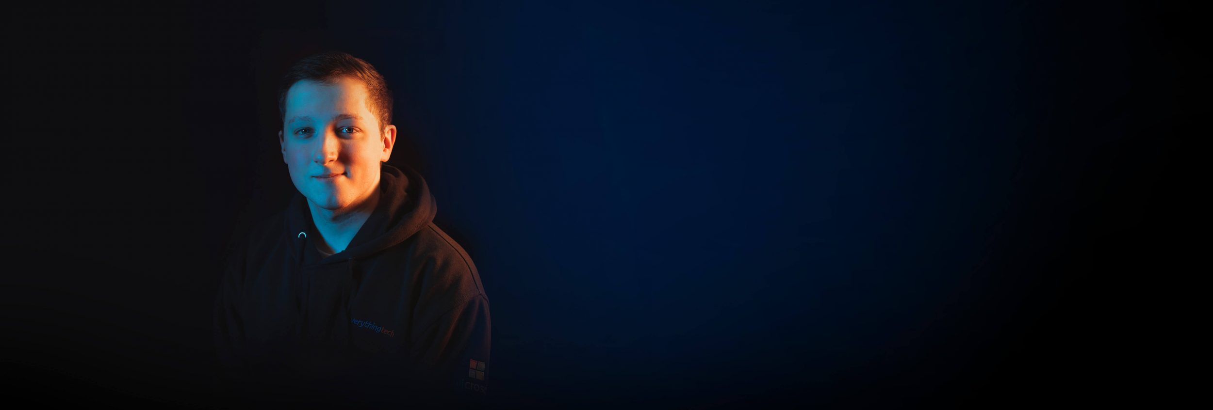 everything tech staff member left side blue gradient background for header