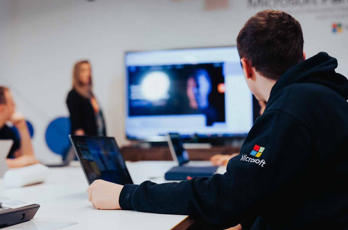 everything techs story - staff member photo during meeting - blurred background